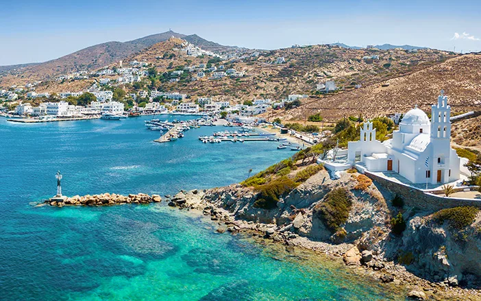 Which Cycladic island is among the 100 most beautiful and authentic islands in the world