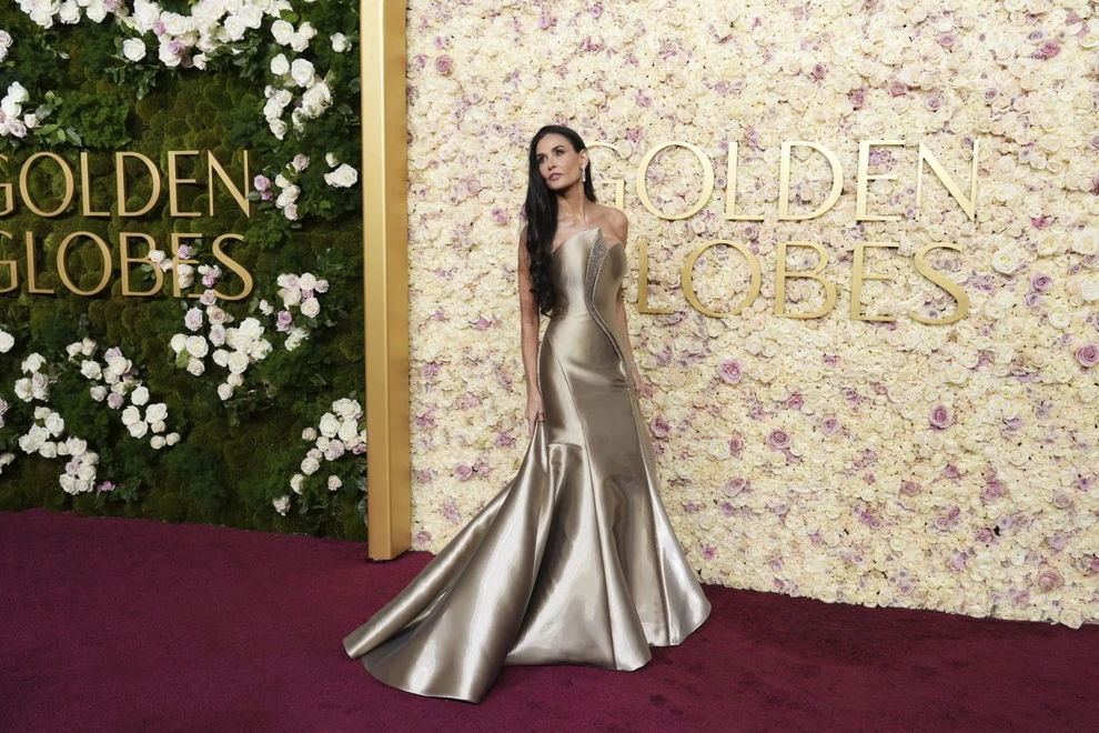 Demi Moore arrives at the 82nd Golden Globes on Sunday, Jan. 5, 2025, at the Beverly Hilton in Beverly Hills, Calif. (Photo by Jordan Strauss/Invision/AP)
